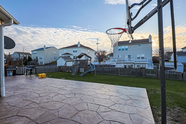 704 Doral Dr, Marengo, IL 60152 - view of patio featuring fence and a playground