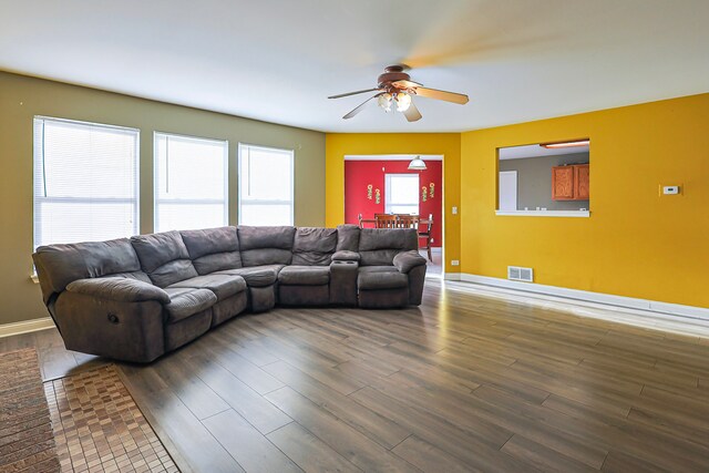 704 Doral Dr, Marengo, IL 60152 - living area with visible vents, baseboards, a ceiling fan, and wood finished floors
