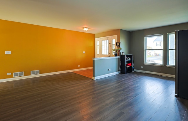 704 Doral Dr, Marengo, IL 60152 - interior space featuring visible vents, baseboards, and dark wood finished floors