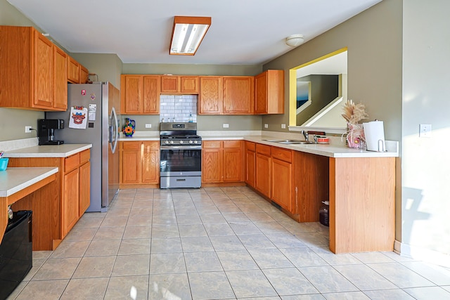 704 Doral Dr, Marengo, IL 60152 - kitchen with stainless steel appliances, light tile patterned floors, light countertops, and a sink