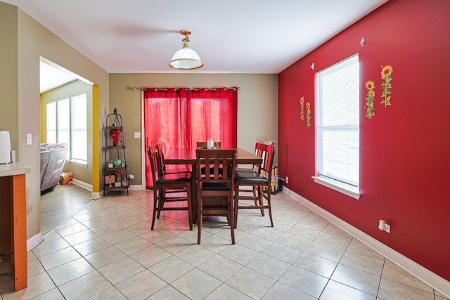 704 Doral Dr, Marengo, IL 60152 - dining room featuring light tile patterned floors and baseboards