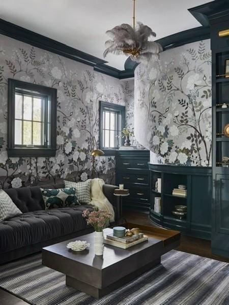 living area with dark wood finished floors, wainscoting, wallpapered walls, and crown molding