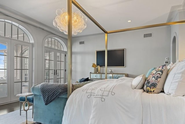 bedroom featuring french doors, visible vents, and ornamental molding