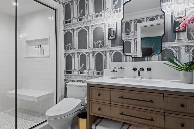 full bath with vanity, toilet, and a shower stall