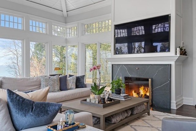 sunroom / solarium with a high end fireplace