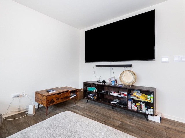 interior space featuring baseboards and wood finished floors