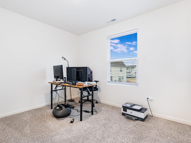 home office with visible vents, baseboards, and carpet