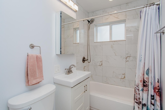 bathroom with vanity, shower / bath combination with curtain, and toilet