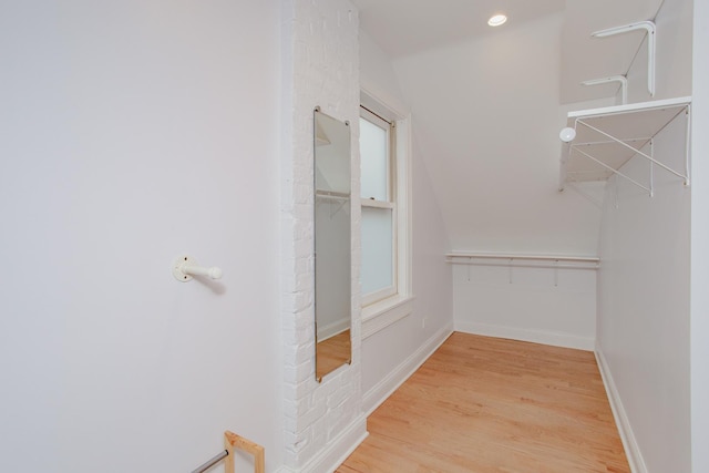 spacious closet with wood finished floors