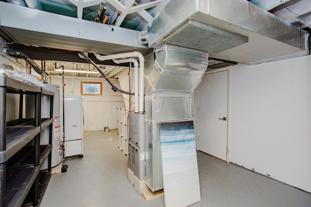 basement featuring gas water heater and washer / dryer