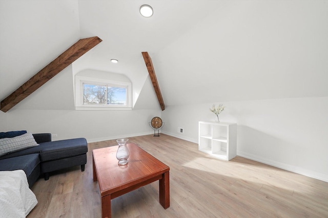 living room with vaulted ceiling with beams, baseboards, and wood finished floors