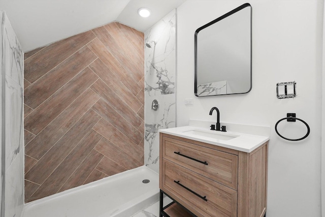 full bathroom featuring a stall shower and vanity