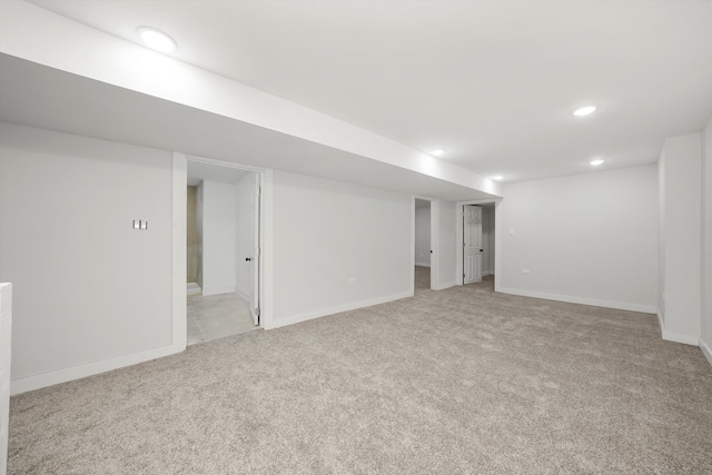 finished below grade area with recessed lighting, baseboards, and carpet