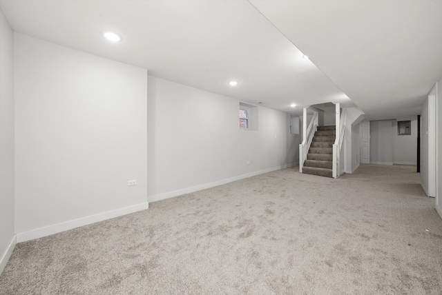 basement featuring recessed lighting, stairway, carpet floors, and baseboards