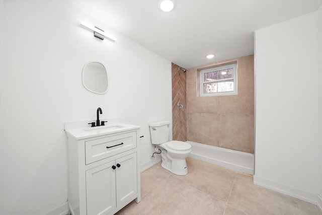 bathroom with a shower, baseboards, toilet, and vanity