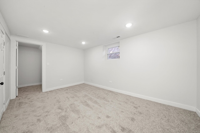 interior space with light carpet, visible vents, recessed lighting, and baseboards