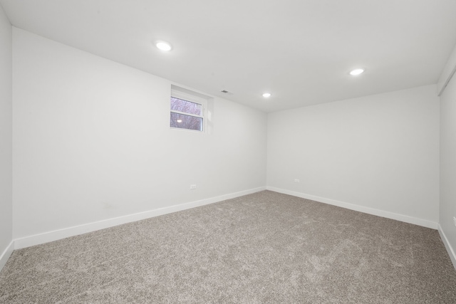 carpeted spare room with visible vents, recessed lighting, and baseboards