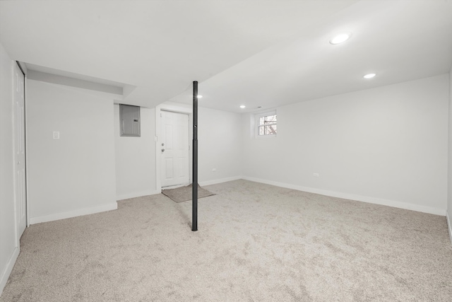 basement with recessed lighting, baseboards, electric panel, and carpet flooring