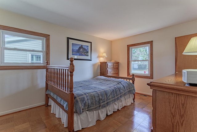 bedroom with visible vents and baseboards