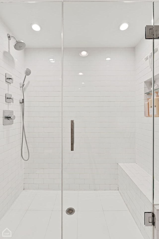 full bath featuring recessed lighting and a shower stall