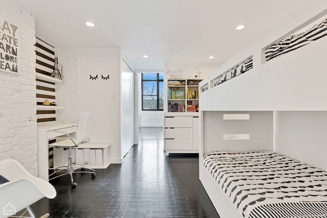 bedroom with wood finished floors and recessed lighting