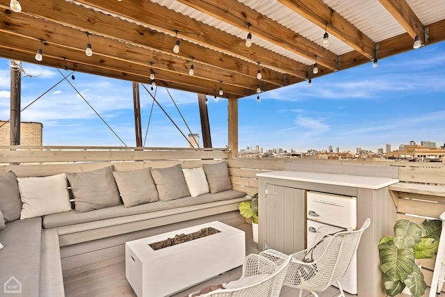 view of patio / terrace featuring an outdoor hangout area and a city view