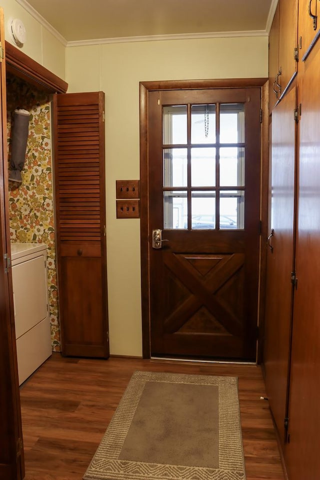 entryway with crown molding, washer / clothes dryer, and wood finished floors