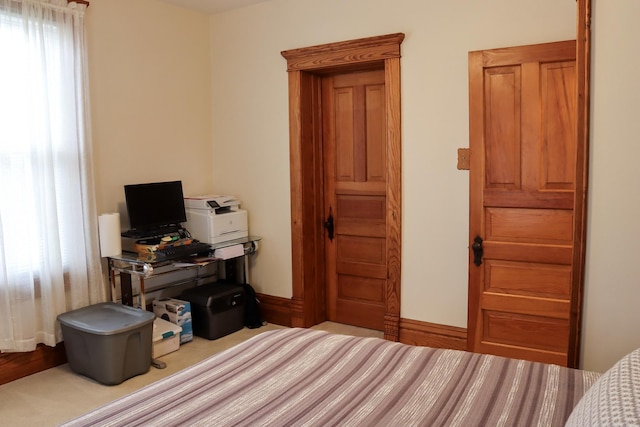 bedroom featuring baseboards