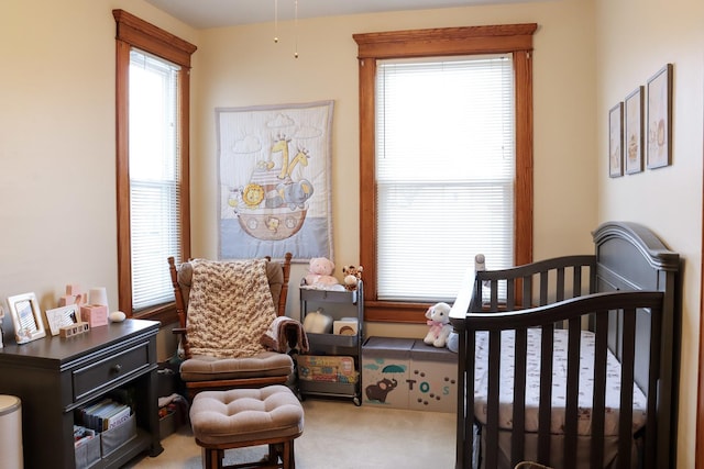 carpeted bedroom with multiple windows