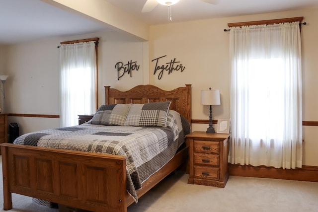 bedroom featuring ceiling fan and light colored carpet