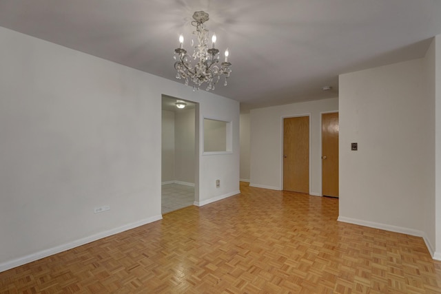 401 S Grove Ave Unit 2F, Oak Park, IL 60302 - unfurnished room with baseboards and a chandelier