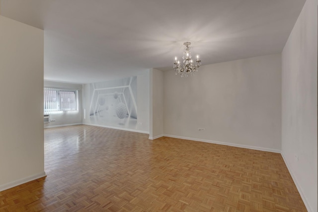 401 S Grove Ave Unit 2F, Oak Park, IL 60302 - spare room featuring a chandelier and baseboards