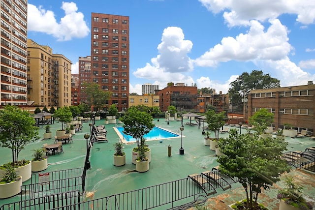 view of pool featuring a view of city