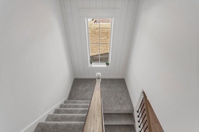 stairs featuring baseboards, carpet floors, and plenty of natural light