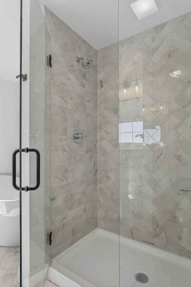 full bath featuring a shower stall