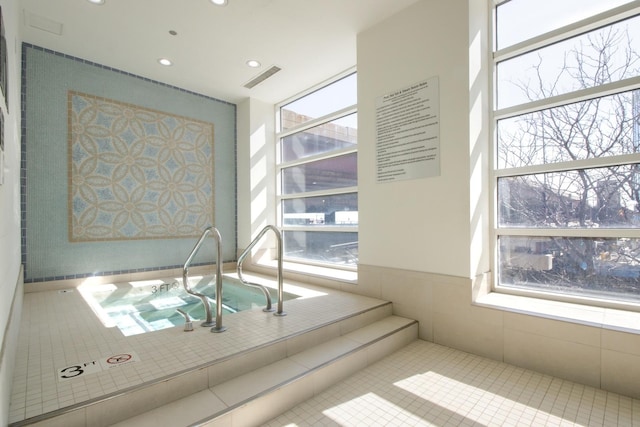 interior space featuring tile patterned floors, recessed lighting, and visible vents