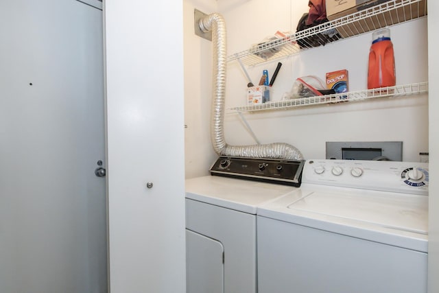 laundry area with washing machine and dryer