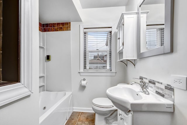 full bath with shower / bath combination, baseboards, toilet, tile patterned floors, and vanity