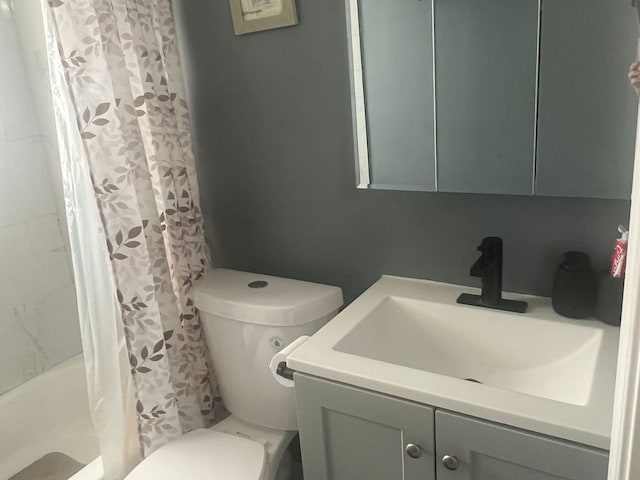 full bath with vanity and toilet