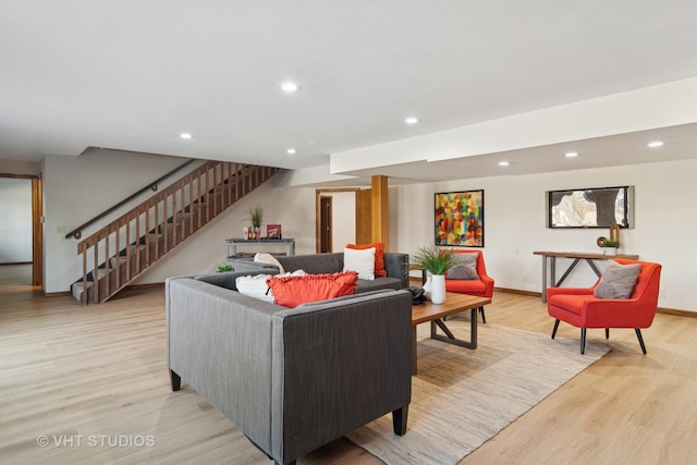 living room with recessed lighting, stairway, baseboards, and light wood finished floors