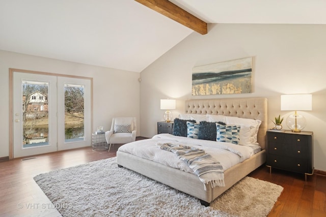 bedroom with access to exterior, lofted ceiling with beams, wood finished floors, and visible vents