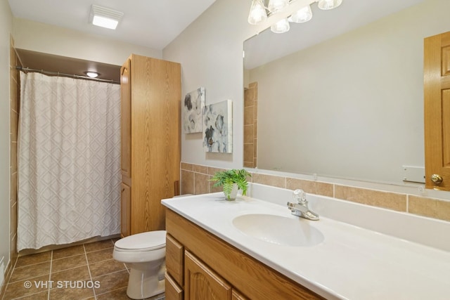 bathroom featuring tile patterned floors, curtained shower, toilet, and vanity