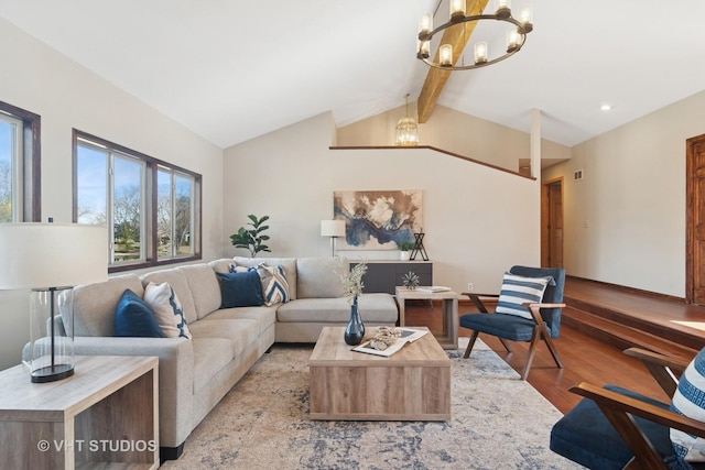 living room with light wood finished floors, baseboards, vaulted ceiling with beams, and an inviting chandelier