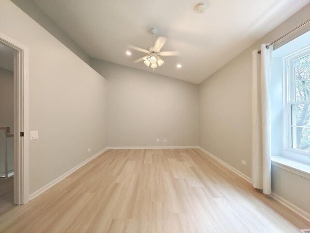 unfurnished room with recessed lighting, light wood-type flooring, a ceiling fan, and baseboards
