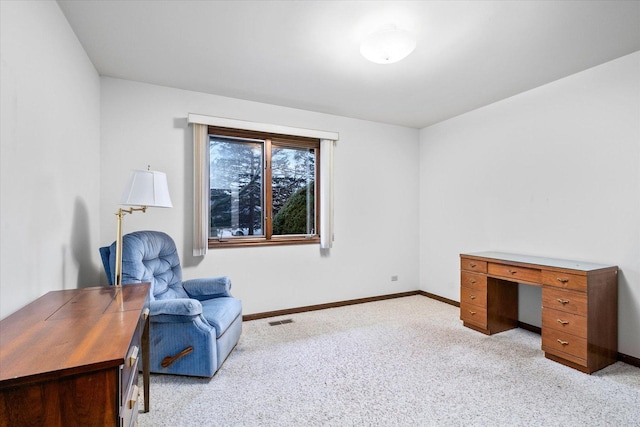 sitting room featuring light carpet, visible vents, and baseboards