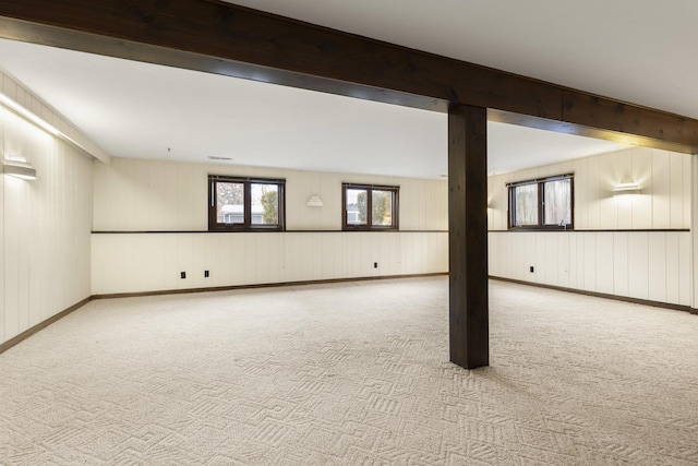 basement featuring carpet and baseboards