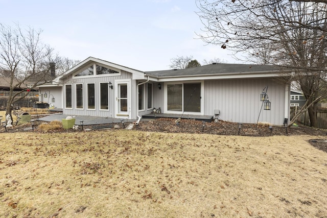 back of house featuring a patio area, fence, and board and batten siding