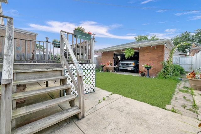 view of yard featuring fence and stairs