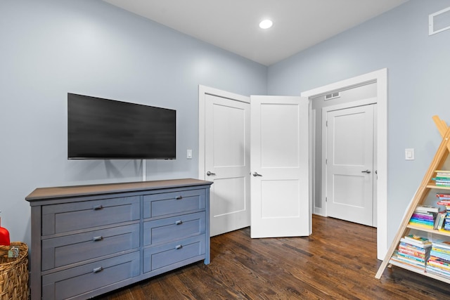 interior space with recessed lighting, visible vents, and dark wood-type flooring