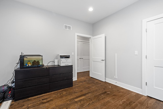 bedroom with visible vents, recessed lighting, baseboards, and wood finished floors